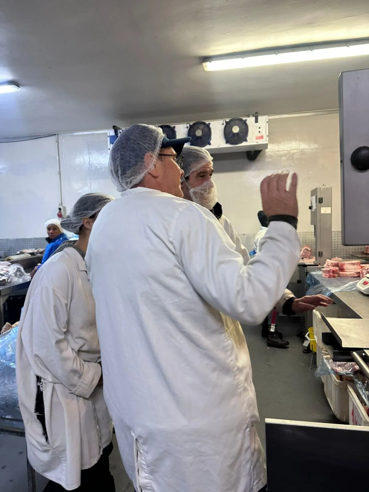 ASC food safety team inspecting a processing facility in full PPE